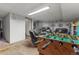 Finished basement featuring a foosball table, comfortable seating, and room for recreation at 4825 S Ammons St # 113, Littleton, CO 80123