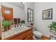 Cozy bathroom featuring a tiled countertop, decor, and a neutral color scheme at 4825 S Ammons St # 113, Littleton, CO 80123