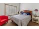 Bedroom with neutral tones, window, and furniture creating a comfortable atmosphere at 4825 S Ammons St # 113, Littleton, CO 80123