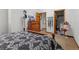 Bedroom features carpet, dresser, and decorative touches, enhancing the room's appeal at 4825 S Ammons St # 113, Littleton, CO 80123