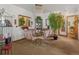 Elegant dining room featuring a glass table, plush chairs, and a chandelier at 4825 S Ammons St # 113, Littleton, CO 80123