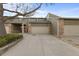 Charming townhome featuring an attached garage, well-maintained landscaping, and a private driveway at 4825 S Ammons St # 113, Littleton, CO 80123