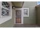 Inviting front entrance featuring a decorative wreath, windows and a secure screen door at 4825 S Ammons St # 113, Littleton, CO 80123