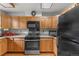 Well-lit kitchen with granite countertops, modern appliances, and ample cabinet space at 4825 S Ammons St # 113, Littleton, CO 80123