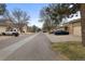 Street view of the neighborhood with townhomes, garages, and landscaping at 4825 S Ammons St # 113, Littleton, CO 80123