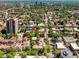 Expansive aerial view of neighborhood with tree-lined streets and a variety of architectural styles at 1100 N Logan St # 9, Denver, CO 80203
