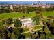 Aerial view of lush gardens and a classical-style building in city park, perfect for relaxation at 1100 N Logan St # 9, Denver, CO 80203
