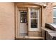Charming back door entrance with adjacent window near a stainless steel outdoor grill at 1100 N Logan St # 9, Denver, CO 80203