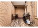 Cozy backyard with deck, brick walls, and furniture, perfect for outdoor relaxation and entertaining at 1100 N Logan St # 9, Denver, CO 80203