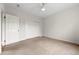 Clean bedroom with neutral walls, carpet floors and ample closet space, creating a blank canvas for personalization at 1100 N Logan St # 9, Denver, CO 80203