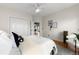 A bright bedroom with hardwood floors and neutral walls featuring ample closet space and natural light at 1100 N Logan St # 9, Denver, CO 80203