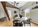 A charming dining area featuring a modern table set, a cozy aesthetic, and a unique ladder to upper level at 1100 N Logan St # 9, Denver, CO 80203