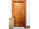 Classic wooden door with decorative panels, offering a warm and inviting entrance to the apartment at 1100 N Logan St # 9, Denver, CO 80203