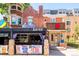 Charming establishment, featuring a colorful facade with outdoor seating and signage at 1100 N Logan St # 9, Denver, CO 80203