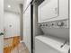 Convenient laundry area with a stackable washer and dryer, plus extra storage space behind sliding doors at 1100 N Logan St # 9, Denver, CO 80203