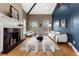 Inviting living room with a fireplace, high ceilings, and large windows offering plenty of natural light at 1100 N Logan St # 9, Denver, CO 80203