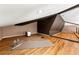 Versatile loft space with hardwood floors, gym mats, and ample lighting, perfect for a home gym or relaxation area at 1100 N Logan St # 9, Denver, CO 80203