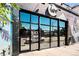 Exterior view of Black Swan Yoga studio with large glass doors at 1100 N Logan St # 9, Denver, CO 80203