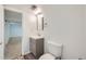 Clean bathroom with modern vanity, mirror, and toilet, offering a fresh and functional space at 17148 E Evans Dr, Aurora, CO 80013