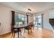 Inviting dining room featuring a large window and glass door providing abundant natural light and backyard views at 17148 E Evans Dr, Aurora, CO 80013