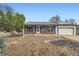 Charming single story home with brick accents and solar panels in a quiet neighborhood with a manicured front yard at 17148 E Evans Dr, Aurora, CO 80013