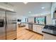 Open concept kitchen area flows seamlessly into the living room and dining area, perfect for modern living at 17148 E Evans Dr, Aurora, CO 80013
