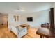 Bright living room boasting hardwood floors, offering a versatile space for relaxation and entertaining at 17148 E Evans Dr, Aurora, CO 80013