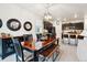 Elegant dining room with a stylish table set and modern lighting adjacent to the kitchen at 7227 Clarke Dr, Frederick, CO 80530