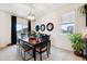 Bright dining area featuring a modern table and seating, complemented by natural light at 7227 Clarke Dr, Frederick, CO 80530