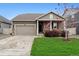 Charming single-Gathering home featuring a well-manicured lawn and an attached two-car garage at 7227 Clarke Dr, Frederick, CO 80530