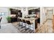 Spacious kitchen featuring a central island with seating, sleek appliances, and modern finishes at 7227 Clarke Dr, Frederick, CO 80530