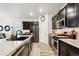 Modern kitchen featuring sleek cabinetry, stainless steel appliances, and ample counter space at 7227 Clarke Dr, Frederick, CO 80530