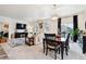 Open-concept living and dining area filled with natural light and stylish furniture at 7227 Clarke Dr, Frederick, CO 80530
