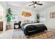 Inviting main bedroom featuring a comfortable bed, large windows, and tasteful decor at 7227 Clarke Dr, Frederick, CO 80530