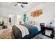 Serene bedroom with neutral colors, stylish decor, and a view into the ensuite bathroom at 7227 Clarke Dr, Frederick, CO 80530