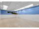 Unfinished basement with blue accents providing a spacious area ready for customization at 1091 E Pinewood Ave, Centennial, CO 80121