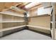 Unfinished basement space featuring open shelving and concrete walls, perfect for storage at 1091 E Pinewood Ave, Centennial, CO 80121