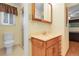 Cozy bathroom featuring a vanity with a marble countertop and a glass door shower at 1091 E Pinewood Ave, Centennial, CO 80121