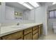 Bathroom with neutral-toned vanity and plenty of lighting at 1091 E Pinewood Ave, Centennial, CO 80121