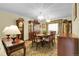 An elegant dining room featuring a classic dining set, chandelier lighting, and traditional decor at 1091 E Pinewood Ave, Centennial, CO 80121