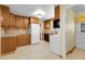 Functional kitchen equipped with essential appliances and ample counter space for culinary tasks at 1091 E Pinewood Ave, Centennial, CO 80121