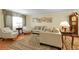 A cozy and elegant living room featuring a plush seating arrangement and classic decor at 1091 E Pinewood Ave, Centennial, CO 80121