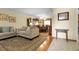 Inviting living room and dining area featuring classic decor, with warm tones and plush furnishings at 1091 E Pinewood Ave, Centennial, CO 80121