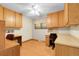 Bright home office with multiple built-in desks and ample cabinet space at 1091 E Pinewood Ave, Centennial, CO 80121