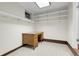 Home office space with ample shelving and a wooden desk, perfect for organization at 1091 E Pinewood Ave, Centennial, CO 80121