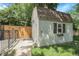 Backyard shed, featuring a window with a flower box, barn door and iron gate for added security at 1091 E Pinewood Ave, Centennial, CO 80121