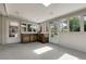 A sunroom with lots of windows, natural light, and access to the backyard at 1091 E Pinewood Ave, Centennial, CO 80121