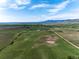Wide aerial view of property situated on large land plot with greenery and mountain views at 8602 N 39Th St, Longmont, CO 80503