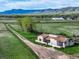 Aerial view showcases the home, expansive land, and scenic surroundings at 8602 N 39Th St, Longmont, CO 80503