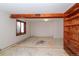 Unfinished basement featuring a wood support beam and built-in shelving at 8602 N 39Th St, Longmont, CO 80503